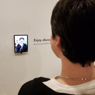 ANTH 335 student interacting with exhibit, "When you are part of the problem..."